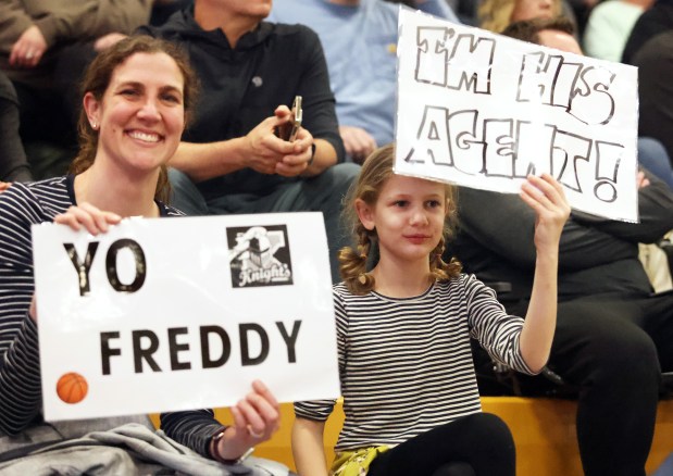 Kaneland fans Erin and Reagan Shore root for Kaneland's Freddy Hassan during an Interstate Eight Conference game against Sycamore on Friday, Feb. 16, 2024 in Sycamore.H. Rick Bamman / For the Beacon News