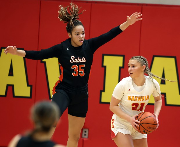 St. Charles East's Corinne Reed (35) blocks Batavia's Kylee Gehrt (21) during a Class 4A Batavia Sectional semifinal game on Tuesday, Feb. 20, 2023 in Batavia.H. Rick Bamman / For the Beacon-News