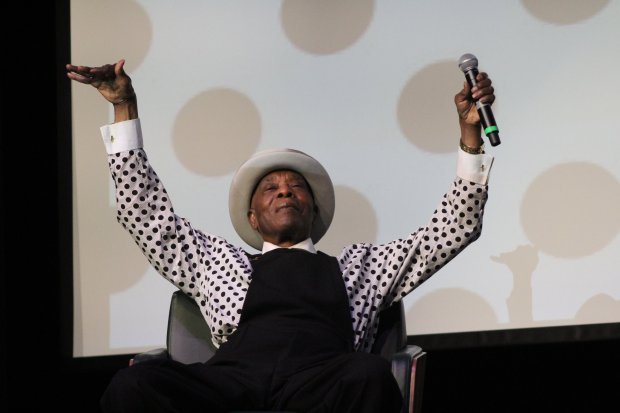 Buddy Guy, 87, of Orland Park, gestures during a Black History Month presentation Feb. 20 at Evergreen Park Community High School. (EPCHS)