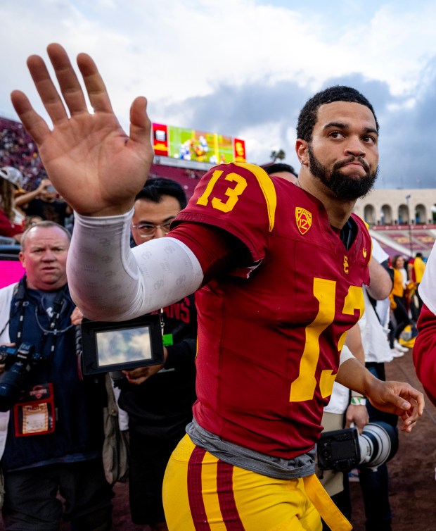 USC quarterback Caleb Williams waves goodbye to fans after a 38-20 loss to UCLA on Nov. 18, 2023, in Los Angeles.