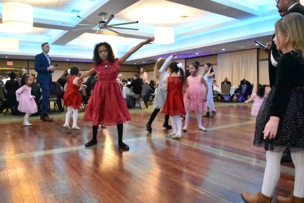 Fathers and their daughters hit the dance floor Feb. 3, 2024 at the "Daddy-Daughter Dance" hosted by the Park District of Franklin Park at the North Park Banquet Hall in Franklin Park.