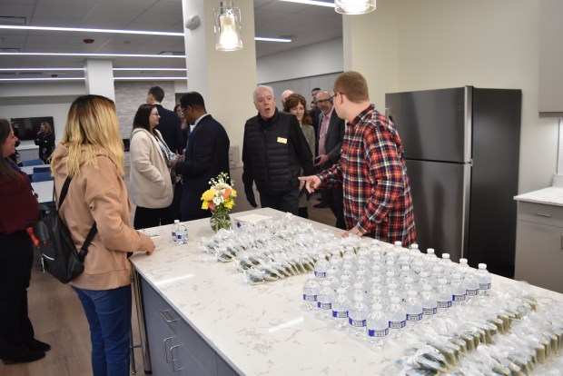 Lake Zurich Mayor Tom Poynton tours the Young Adult Center Feb. 9. School district officials thanked the community for support of the project that's taken about two years to realize.