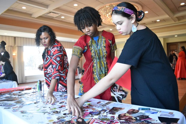 Girls in attendance at the annual Black History Month "Uniquely You Tea Party" Feb. 11, 2024 used torn out magazine pages to create vision boards. The even was held at the Oak Park Country Club in Oak Park.