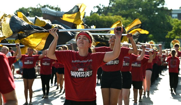 Quinna Sheets, a senior at Grayslake North High School, performs with the Grayslake North Marching Knights on Center Street at the Grayslake Summer Days Parade on Aug. 19, 2023 in downtown Grayslake.