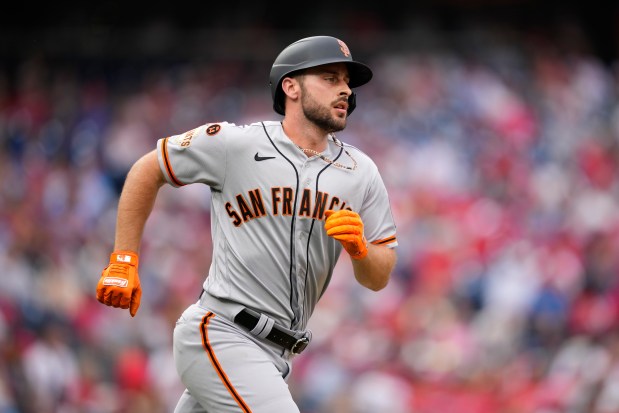 San Francisco Giants' Paul DeJong runs the baseline during a baseball game, Aug. 23, 2023, in Philadelphia.