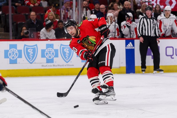 Chicago Blackhawks center Tyler Johnson (90) passes the puck during the first period against the Washington Capitals at the United Center on Dec. 10, 2023.