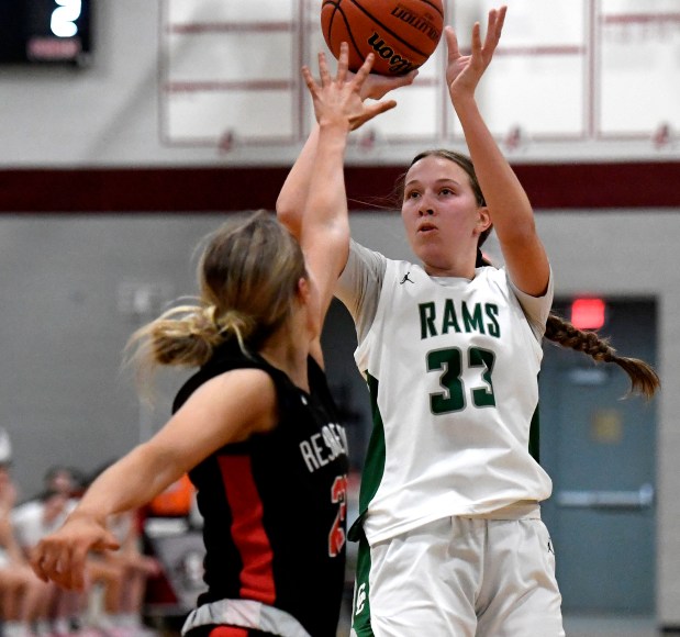 Grayslake Central's Madison Hoffmann, right, shoots over Resurrection's Ela Via during their Class 3A Antioch Sectional girls basketball semifinal at Antioch High School in Antioch, Tuesday, February 20, 2024. (Michael Schmidt/Lake County News-Sun)