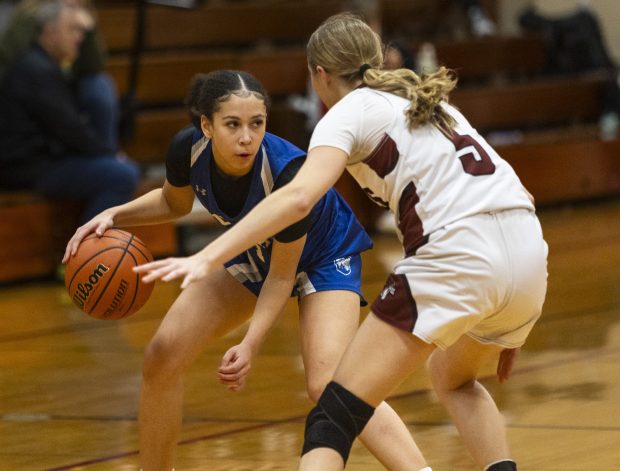 Vernon Hills' Maliyah Mays (1) looks for a hole in the Antioch defense during the Class 3A Chicago Resurrection Regional semifinal in Chicago on Tuesday, Feb. 13, 2024. (Vincent D. Johnson / News-Sun).