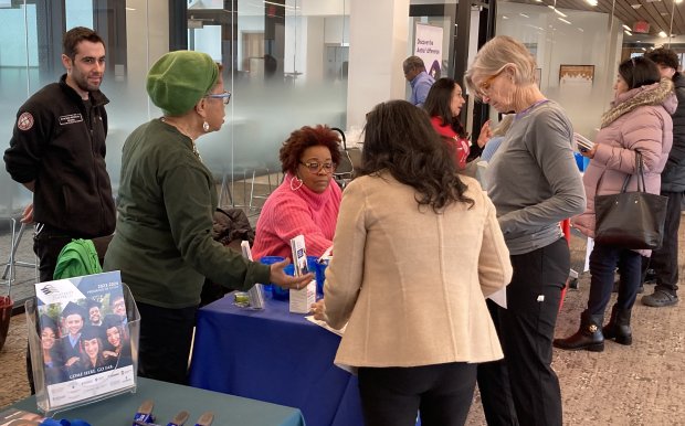 Mary Roberson, second from left, the CEO of NIRCO, talks to people at the Self Care Health Fair Saturday in Waukegan.