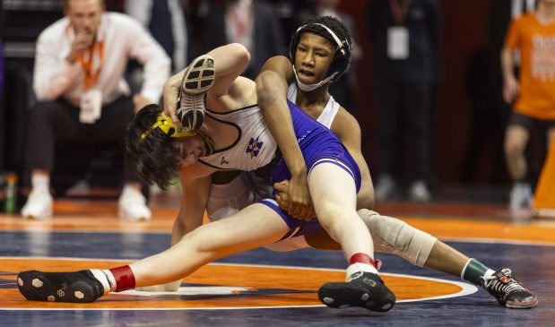 Warren's Caleb Noble, right, and Hononega's Rocco Cassioppi battle during the 106 pound bout in the class 3A state wrestling championship at the State Farm Center at University of Illinois in Champaign on Saturday, Feb. 17, 2024. (Vincent D. Johnson / Daily Southtown).