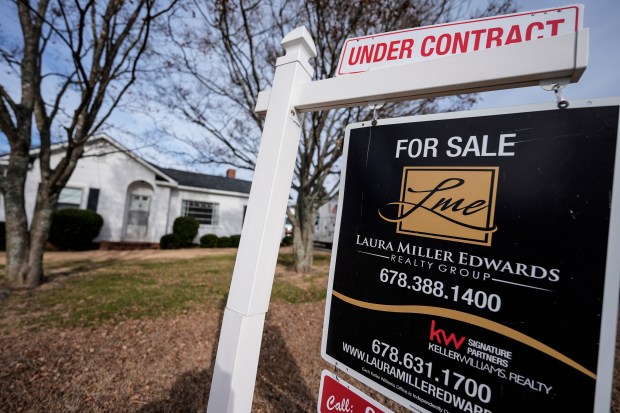 A sign indicating that a home is under contract is shown on Tuesday, Jan. 16, 2024, in Kennesaw, Ga.