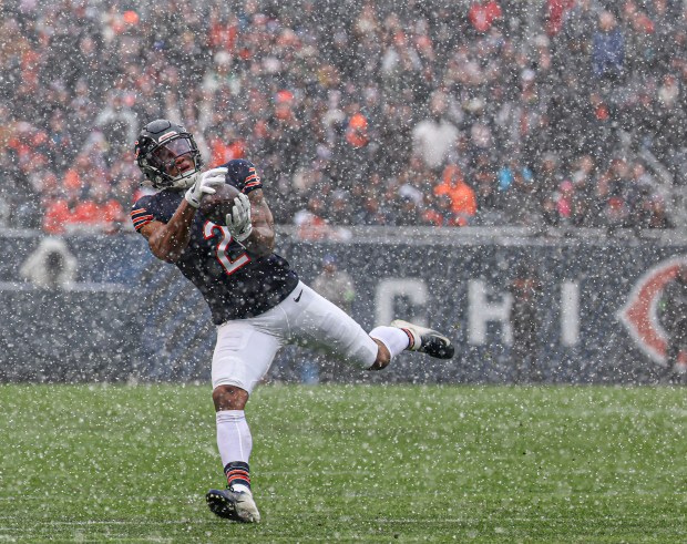 Chicago Bears wide receiver DJ Moore makes a long reception against the Atlanta Falcons on Sunday, Dec. 31, 2023, at Soldier Field.