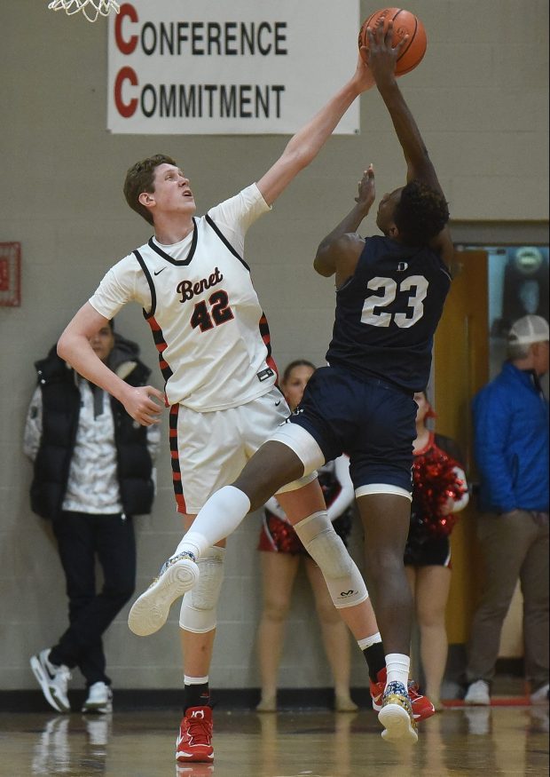 Benet's Colin Stack (42) blocks a shot attempt by DePaul Prep's Jaylan McElroy (23) during a non-conference game Friday, February 16, 2024 in Lisle, IL. (Steve Johnston/Naperville Sun)