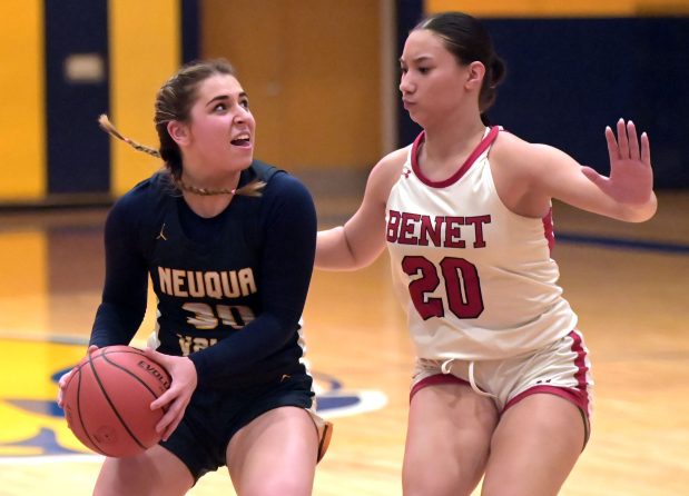 Neuqua Valley's Quinn Sigal is blocked at the basket by Benet's Emma Briggs. Benet defeated Neuqua Valley, 47-44, in a Class 4A Neuqua Valley Regional championship girls basketball game Thursday, February 15, 2024, in Naperville, Illinois. (Jon Langham/Photo for Naperville Sun)