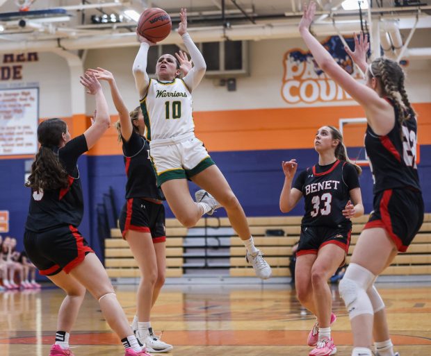 Waubonsie Valley's Danyella Mporokoso (10) shoots a layup during the Class 4A Oswego Sectional championship game against Benet Academy on Thursday, Feb. 22 2024. (Troy Stolt for the Naperville Sun)