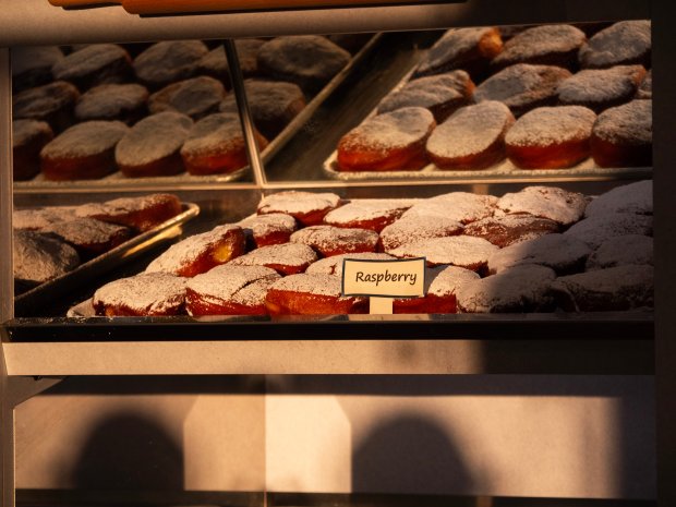 A tray of paczkis sits in a case at Fiene's Bakery in Naperville on Friday, Feb. 9 as Paczki Day 2024 gets underway. (Tess Kenny/Naperville Sun)