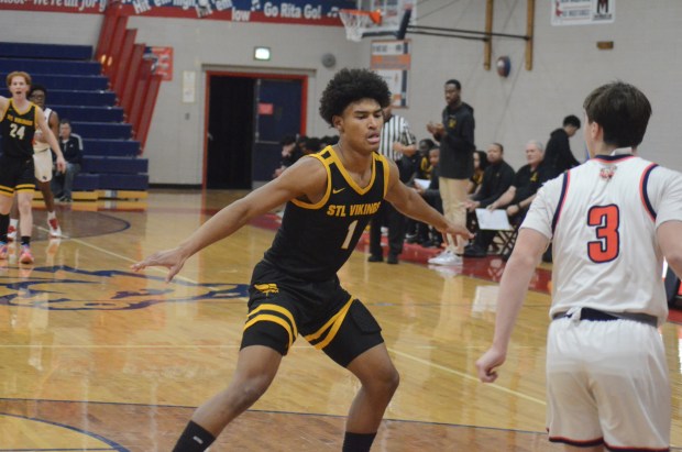 St. Laurence's Josh Pickett defends against St. Rita during a Catholic League crossover game on Wednesday, Jan. 30, 2024. (Jeff Vorva / Daily Southtown)