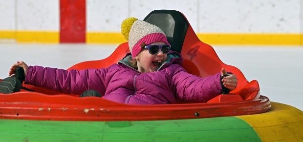 Showing delight on the ice bumper cars is Rachel Adams, 8, a third-grader from Glencoe during Subzero Shenanigans at the Weinberg Family Recreation Center on Feb. 19, 2024 in Glencoe. Karie Angell Luc for Pioneer Press