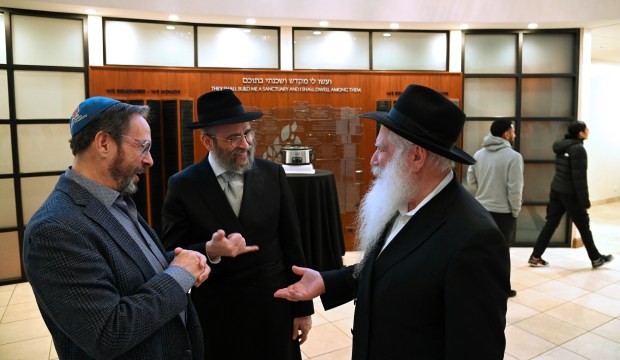 From left to right, Joseph Jaeger of Lincolnshire, Rabbi Dovid Flinkenstein of Wilmette and Rabbi Manis Friedman of Brooklyn, New York before the Shabbat dinner event at Chabad Center for Jewish Life and Learning in Wilmette on Feb. 9, 2024.