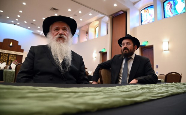 From left to right, Rabbi Manis Friedman of Brooklyn, New York and Rabbi Moshe Teldon of Wilmette, associate rabbi at Chabad Center Wilmette, before the Shabbat dinner event at Chabad Center for Jewish Life and Learning in Wilmette on Feb. 9, 2024.