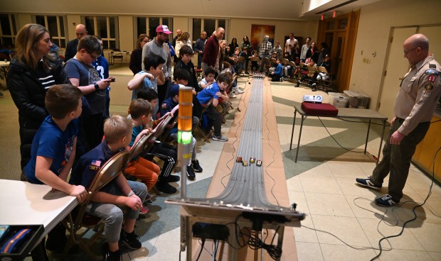 Far right, Khalid Ghantous of Winnetka, Cubmaster of Cub Scout Pack 18, is part of the action at the Cub Scout Pack 18 Pinewood Derby on Jan. 31, 2024 in Winnetka at Winnetka Presbyterian Church (1255 Willow Road).