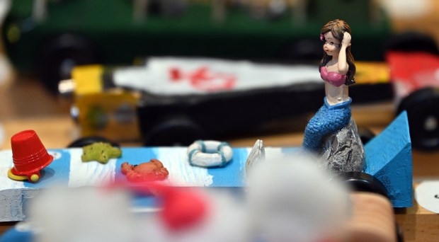 No, that is not Taylor Swift on a derby car parked next to a Kansas City Chiefs car. That's a mermaid, among creative creatures adorning carsa seen at the Cub Scout Pack 18 Pinewood Derby on Jan. 31, 2024 in Winnetka at Winnetka Presbyterian Church (1255 Willow Road).