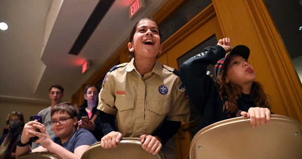 Cheering on racing action, are, from left to right, Laila Dearth, 10, a fifth-grader of Winnetka and Nora Ryadi, 11, a fifth-grader also of Winnetka, at the Cub Scout Pack 18 Pinewood Derby on Jan. 31, 2024 in Winnetka at Winnetka Presbyterian Church (1255 Willow Road).