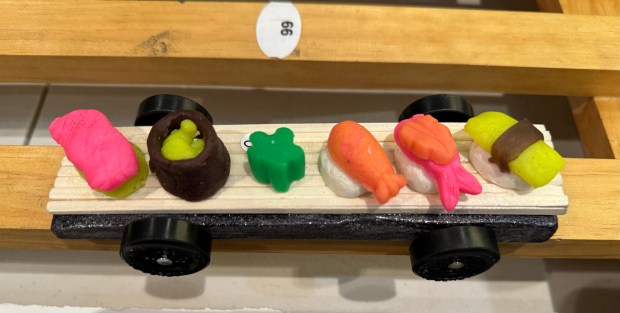 This car with sushi on it was crafted by Wyatt Ghantous, 11, a Winnetka fifth-grader at The Skokie School, the son of Khalid Ghantous of Winnetka, Cubmaster of Cub Scout Pack 18, for the Cub Scout Pack 18 Pinewood Derby on Jan. 31, 2024 in Winnetka at Winnetka Presbyterian Church (1255 Willow Road). Yes, Wyatt eats sushi. The green wasabi was put on in honor of dad's taste.