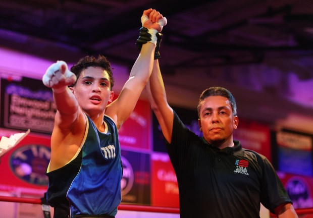 Bryan Rivera, left, celebrates a win against James Horn, not pictured, in the 120 pound bout during "Fight Night" Feb. 16, 2024 at the Elmwood Park Parks and Recreation Center in Elmwood Park. (Trent Sprague/Pioneer Press)