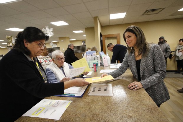 Lake County Recorder Gina Pimentel (right) was first in line to file during the first day to file for office for the 2024 election cycle at the Lake County Government Center. Helping Pimentel was clerk Gina Alavanja (left) and Assistant Election Administrator Genevieve Gasparovic (center). Multiple county offices are up as well as some state representatives on Wednesday, January 10, 2024. (John Smierciak/Post Tribune)