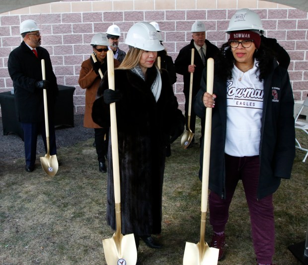 Eve Gomez, President Drexel Foundation, (center) hands out shovels during a groundbreaking ceremony on a $8 million addition to the Thea Bowman Leadership Academy in Gary on Feb. 3, 2024. The addition will be a two-story eight classroom building for elementary students. There will also be a multipurpose room for athletics and arts, a health clinic, new athletic fields with a track and football field and a maintenance building.