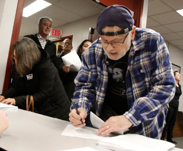 George Grenchik, as a young boy, witnessed the refinery explosion in 1955 when he lived in Whiting. Grenchik signs in during a public meeting to discuss air permitting for BP Products of North America. East Chicago school officials cancelled a planned Indiana Department of Environmental Management (IDEM) public meeting more than a week ago, a second one was held at Calumet College of St. Joseph in Whiting on Thursday, February 22, 2024. (John Smierciak/Post Tribune)