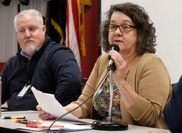 Jenny Acker, (right) Branch Chief Air Permits Branch, IDEM, speaks to the crowd as Matt Stuckey (left) also from IDEM listens during a public meeting to discuss air permitting for BP Products of North America. East Chicago school officials cancelled a planned Indiana Department of Environmental Management (IDEM) public meeting more than a week ago, a second one was held at Calumet College of St. Joseph in Whiting on Thursday, February 22, 2024. (John Smierciak/Post Tribune)