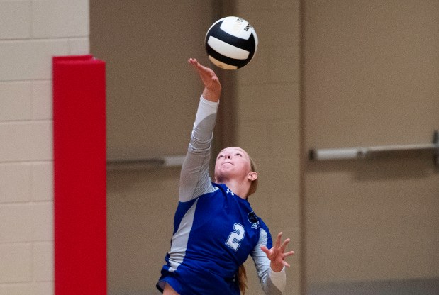 Lake Central's Alexa Iwema serves the ball during a match against host Crown Point on Tuesday, August 29, 2023. (Michael Gard / Post-Tribune)