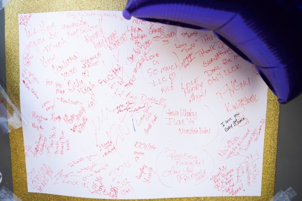 A poster signed by well-wishers is taped on the front door of Fatso's Pub in Gary as part of a memorial for the owner, Crystal Kennebrew, who was killed Monday morning in a shooting in Indianapolis. (Kyle Telechan for the Post-Tribune)