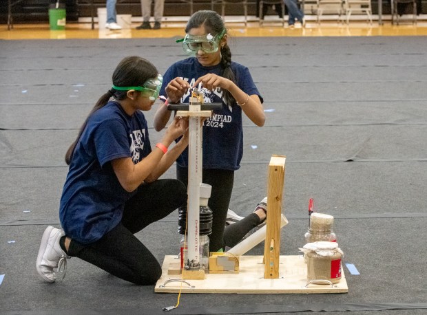 Kahler Middle School teammates Pari Patel, left, and Krupa Patel prepare to compete in the Air Trajectory category competition at the Science Olympiad Regional Tournament at IU Northwest in Gary, Indiana Saturday February 17, 2024. (Andy Lavalley for the Post-Tribune