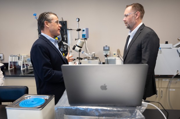 US Senator Todd Young (R-IN), on left, speaks with Neurodon CEO Russell Dahl during a walkthrough of the company's lab on Thursday, Februrary 15, 2024. (Kyle Telechan for the Post-Tribune)