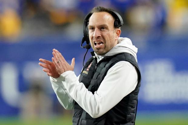 Boston College coach Jeff Hafley applauds during a game at Pittsburgh on Nov. 16, 2023.