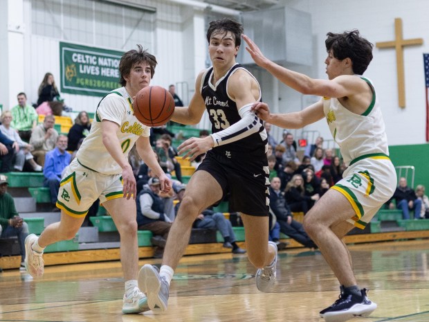 Mount Carmel's Angelo Ciaravino (33) breaks through the defense against Providence during a Catholic League crossover in New Lenox on Tuesday, Dec. 5, 2023.