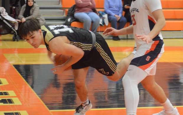 Lemont's Simas Dyglys (11) saves the ball from going out of bounds against Stagg during a nonconference game in Palos Hills on Wednesday, Jan. 31, 2024. (Jeff Vorva / Daily Southtown)