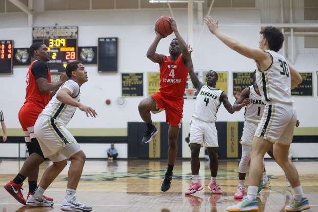 Rich Township's Samar Bures (4) goes up for a layup during a game against Oak Forest in Oak Forest on Monday Feb. 5, 2024. (Troy Stolt for the Daily Southtown)