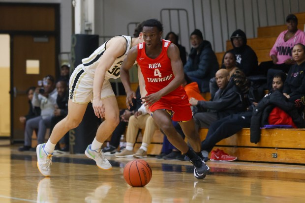 Rich Township's Samar Bures (4) makes a move on a defender during a game against Oak Forest in Oak Forest on Monday Feb. 5, 2024. (Troy Stolt for the Daily Southtown)