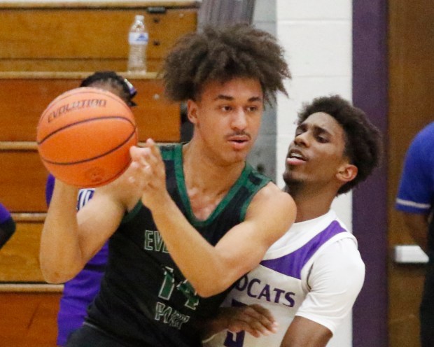 Evergreen Park's Tre Dowdell (left) drives into Thornton's Meyoh Swansey (3) during the Class 3A Thornton Sectional basketball semifinals on Tuesday February 27, 2024. (John Smierciak for the Daily Southtown)