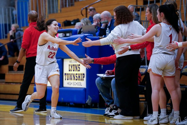 Maeve Egan (22) from Mother McAuley leaves the game during the fourth quarter of their IHSA Class 4A Girls Basketball Regional semi-final game against Richards at Lyons Township High School on Monday, February 12, 2024 in LaGrange, Illinois. The Mighty Macs defeated the Bulldogs 58-30 to advance to their regional final. ( John Konstantaras-Daily Southtown ) | 3156497_STA-L-GBK-LYONS-REG-0214