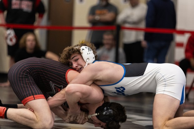 Lincoln-Way East's Rory Moran defeats Lincoln-Way Central's Tim Key in the 165 pound championship bout during the IHSA Class 3A Rich Township wrestling regional in Richton Park on Saturday, Feb. 3, 2024. (Vincent D. Johnson / Daily Southtown).