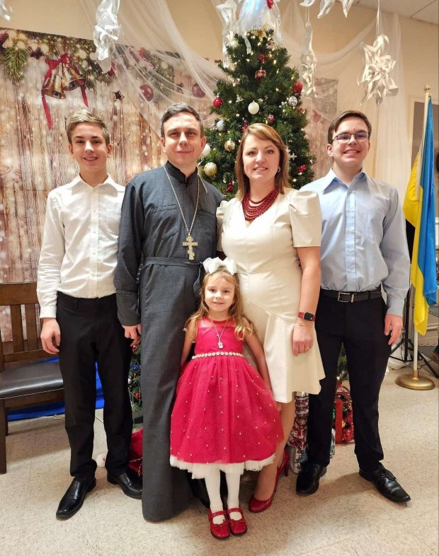 Rev. Vasyl Sendeha, priest at Saints Peter and Paul Ukrainian Orthodox Church in Palos Park, with his family Jan. 7, 2023, said he worries about who will rebuild Ukraine when the Russia Ukraine war ends. (Family photo)