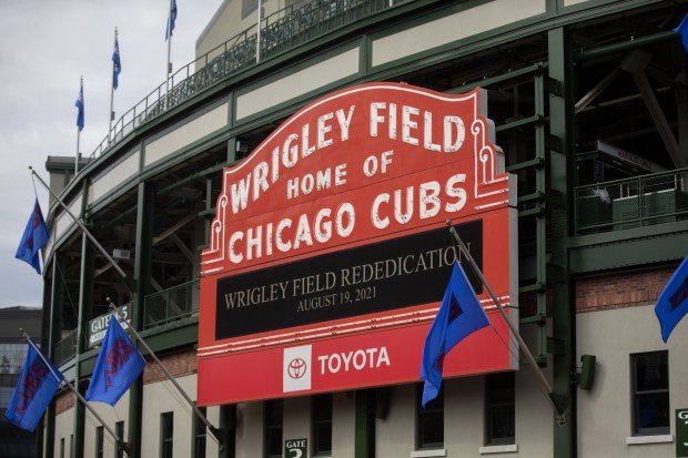 The Wrigley Field marquee announces a rededication event on Aug. 19, 2021. (Erin Hooley / Chicago Tribune)