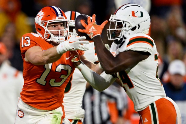 Miami's Kamren Kinchens breaks up a pass intended for Clemson's Brannon Spector on Nov. 19, 2022, in Clemson, S.C. (Eakin Howard/Getty Images)