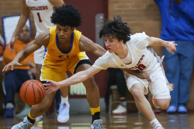 Brother Rice's Cale Cosme (10) steals the ball from De La Salle's Richard Lindsey (21) during a Catholic League Blue game in Chicago on Friday, Dec. 15, 2023.