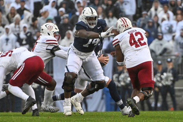 Penn State offensive lineman Olu Fashanu blocks against Massachusetts on Oct. 14, 2023, in State College, Pa. (Barry Reeger/AP)